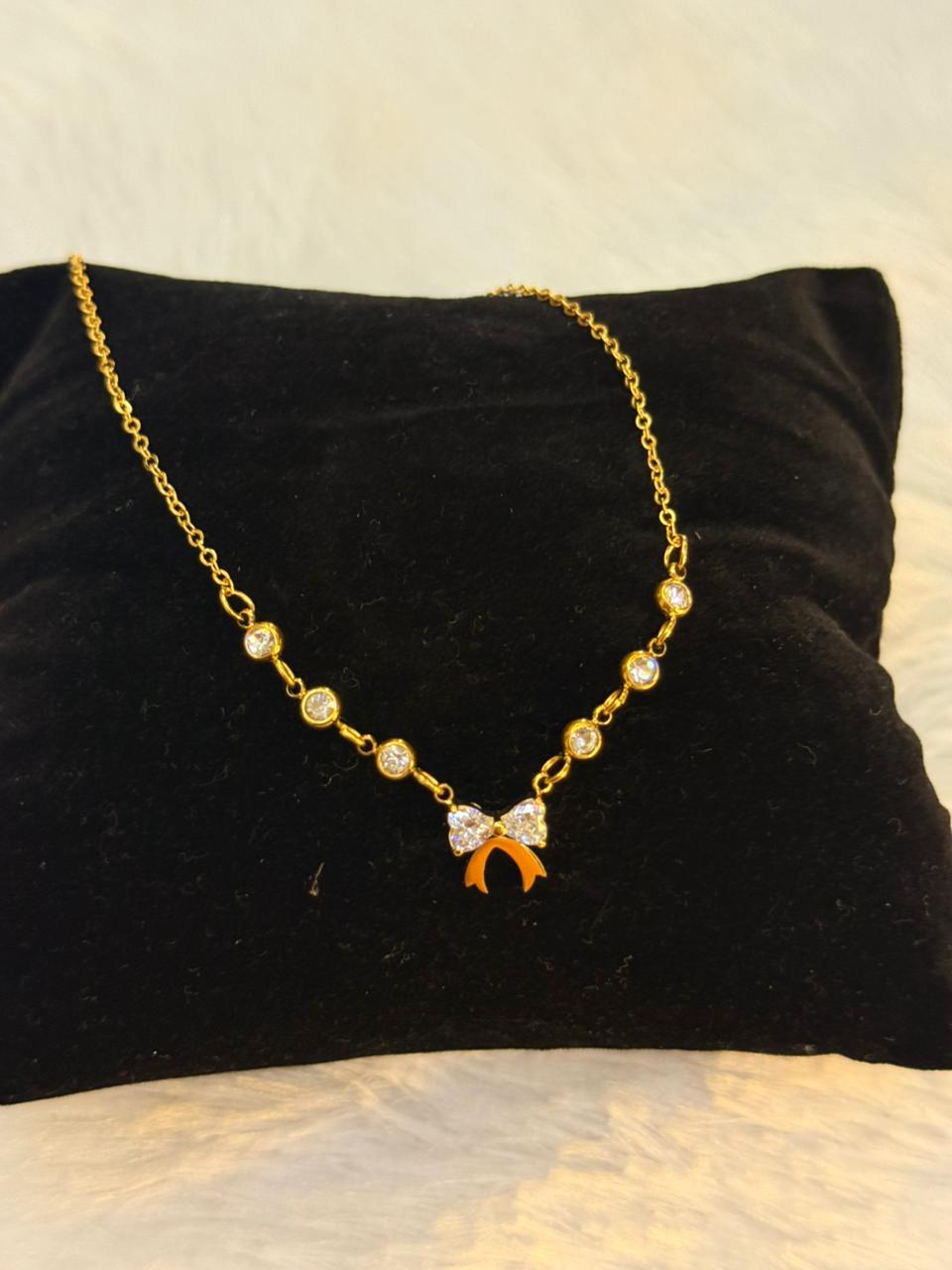 bow with diamond neckpiece