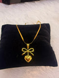 heart bow with snakechain pendant
