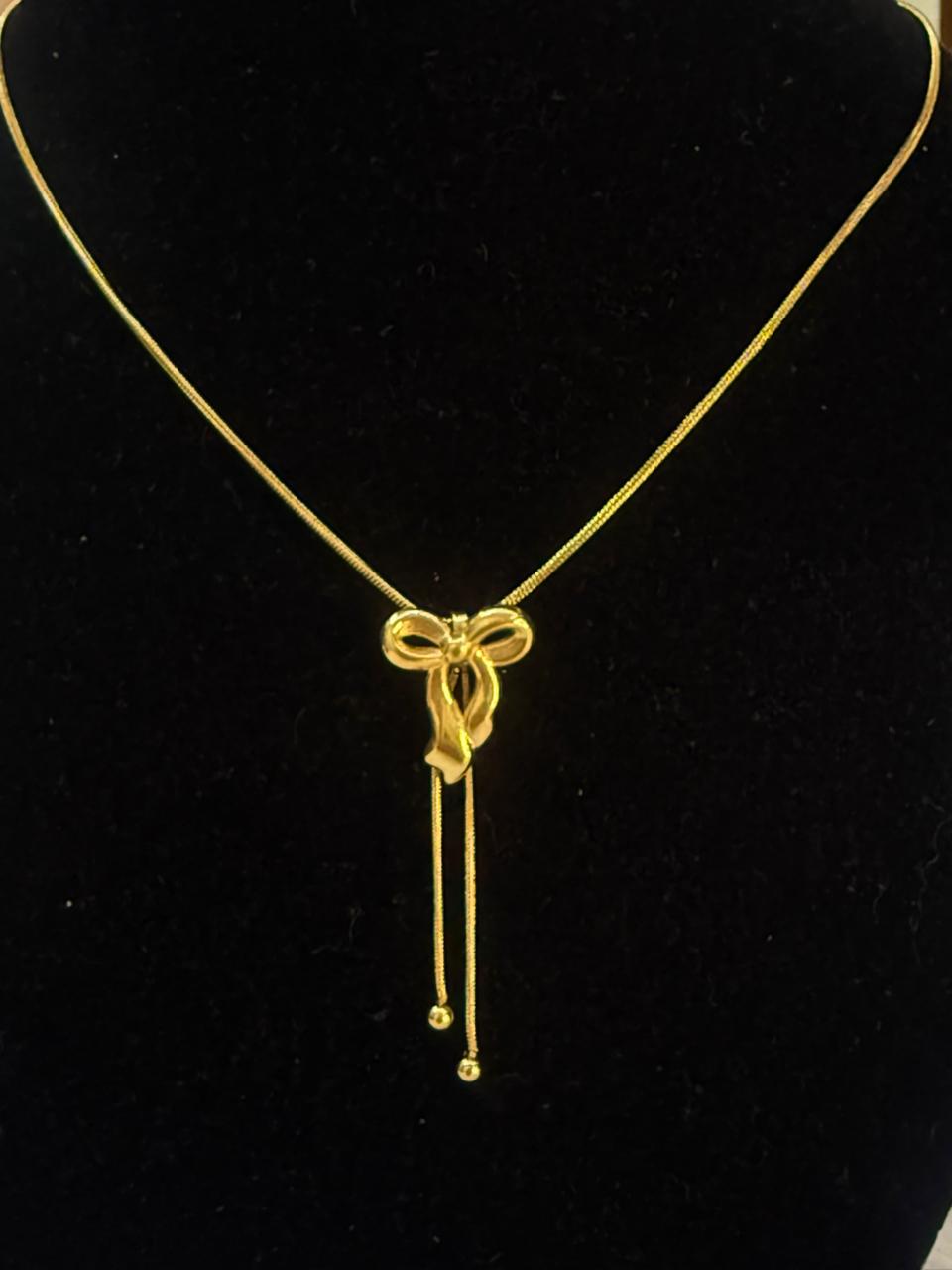 Hanging bow pendant